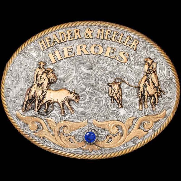 "Our Clovis Belt Buckle is a tribute to the synergy & hard work both the header and heeler face together in Team Roping. This Buckle is crafted on a German Silver base with a natural finish.  It is detailed with a Jeweler's Bronze rope edge and J